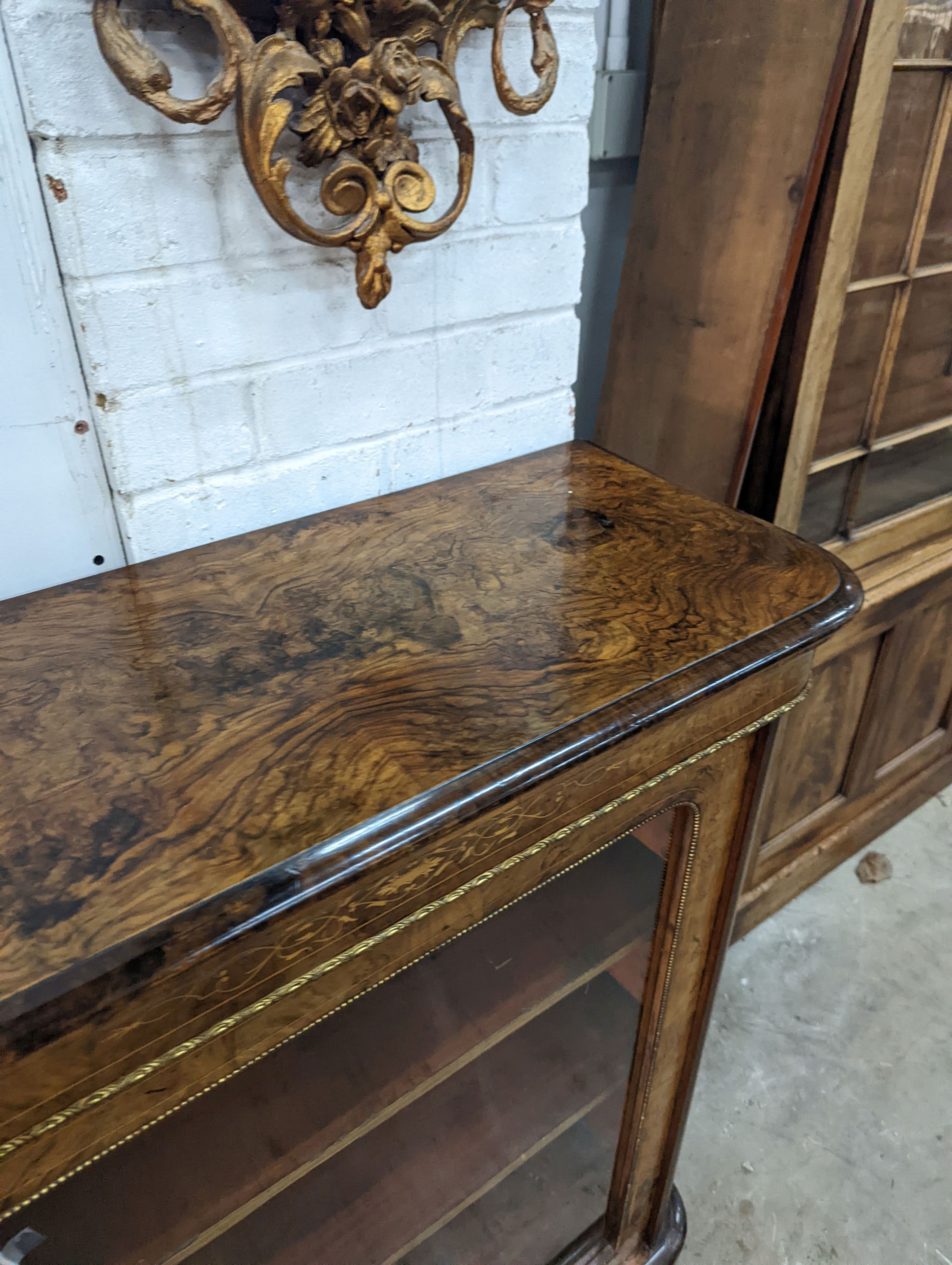 A Victorian inlaid gilt metal mounted figured walnut pier cabinet, width 84cm, depth 35cm, height 105cm